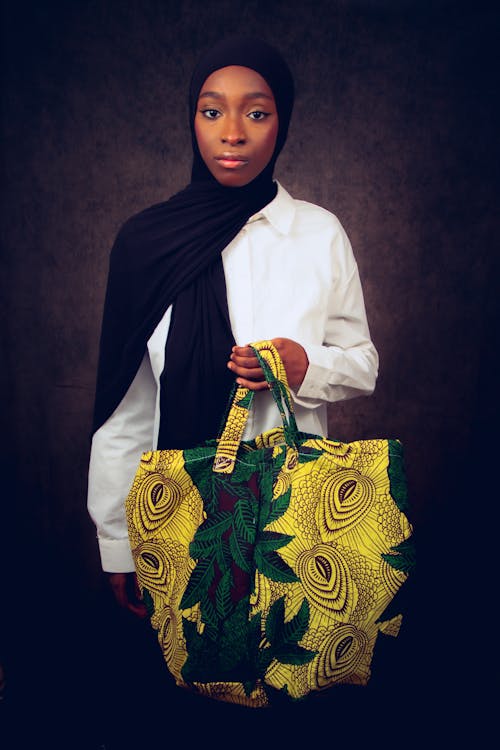 Young Woman Holding a Bag with a Colorful Pattern 