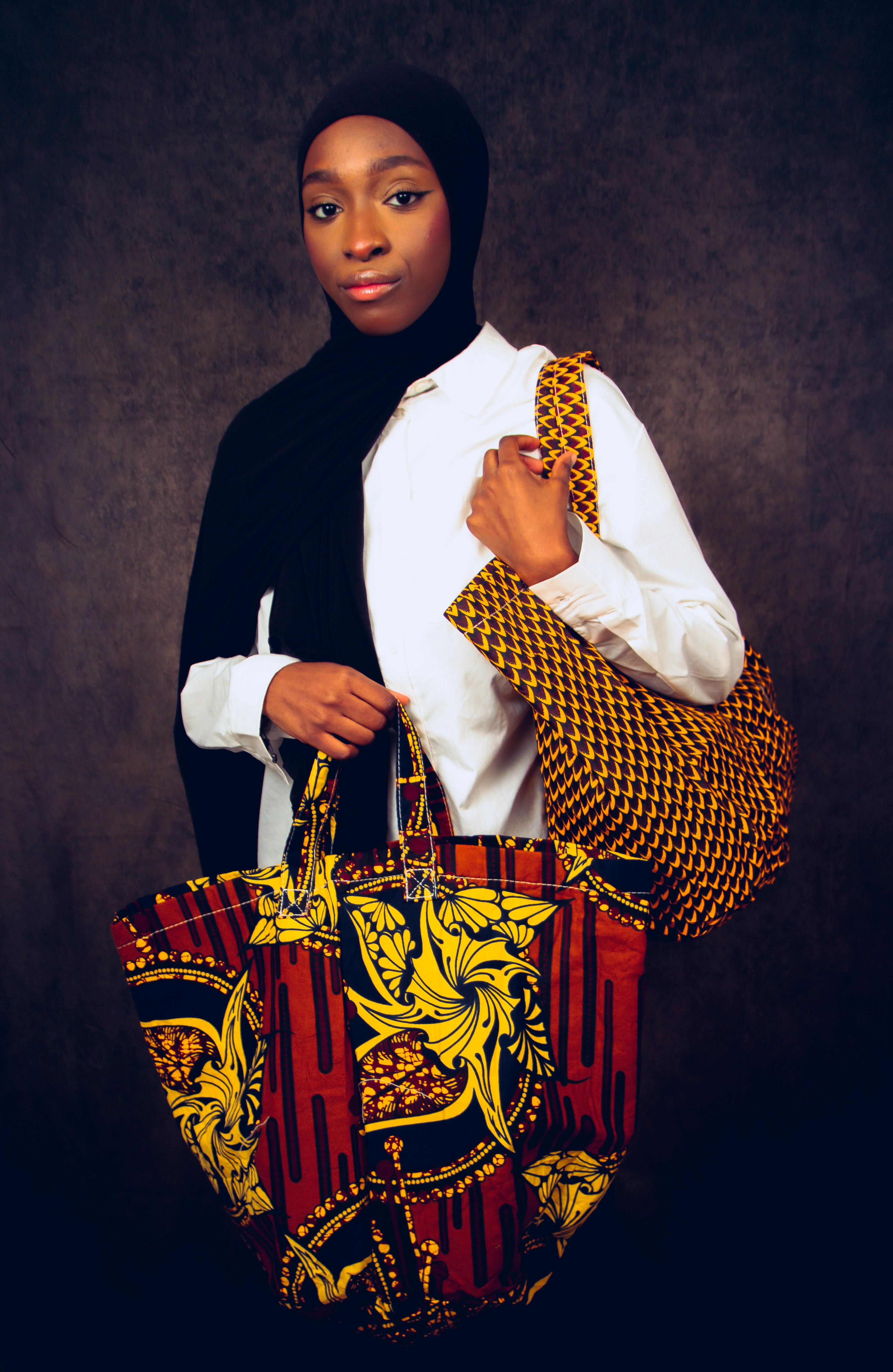 A Person Holding a Rainbow Tote Bag · Free Stock Photo