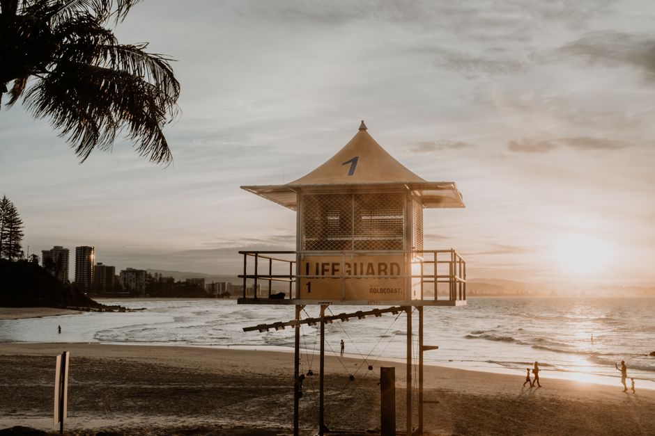 A stunning sunset view of a lifeguard tower at Coolangatta Beach, Queensland.