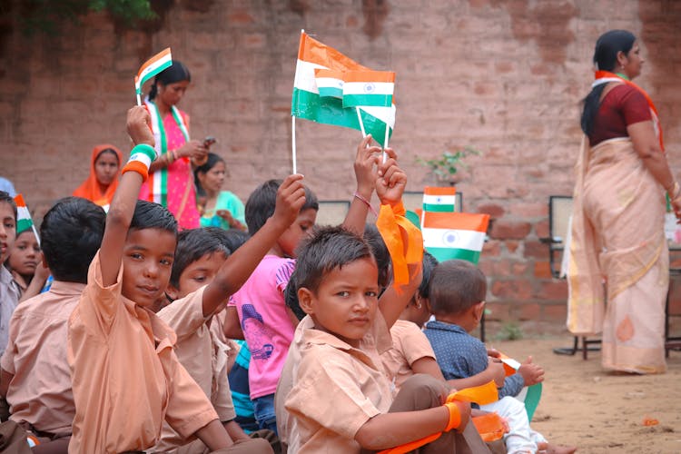 Group Of Children Waving Flags Of India