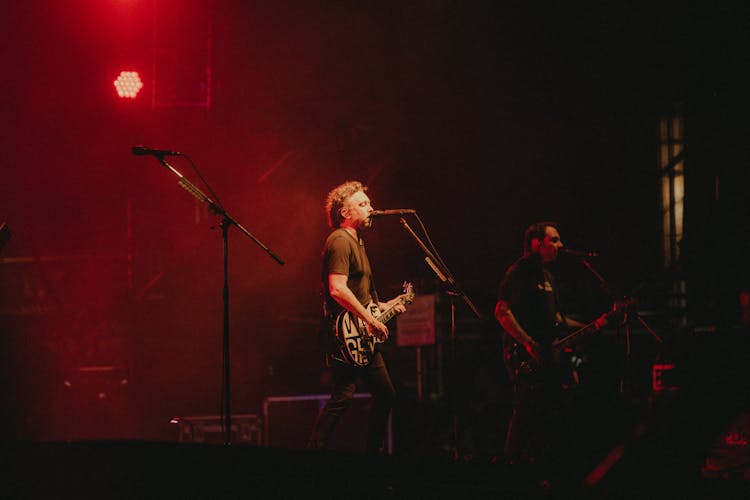 Band Singing On Stage At Rock Concert