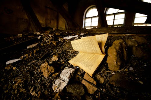 Book on Ground in Old Abandoned Building