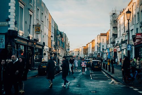 Free Busy street scene in Notting Hill, London with people and classic architecture. Stock Photo