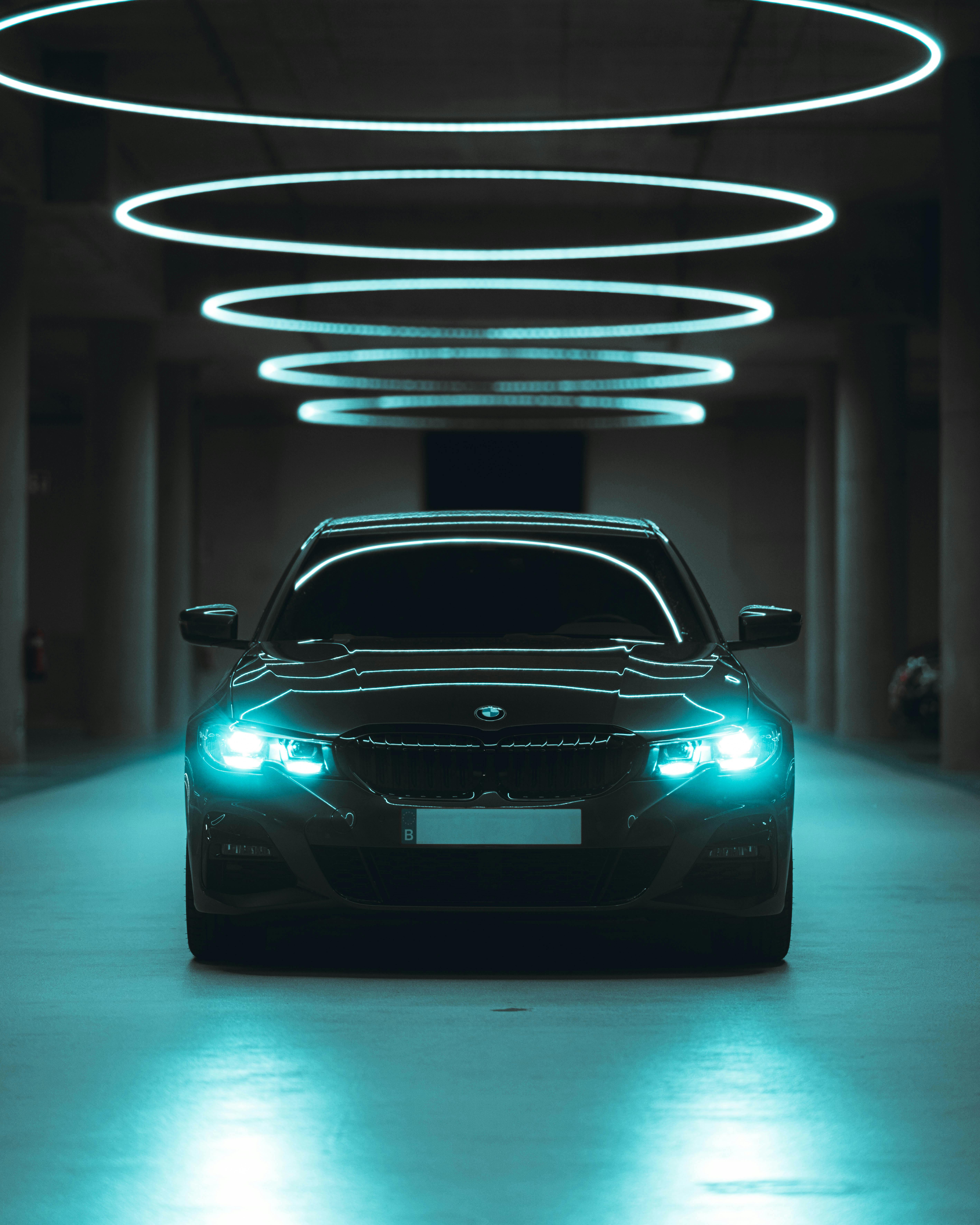 Minimalist and futuristic car interior with a large panoramic display and ambient lighting