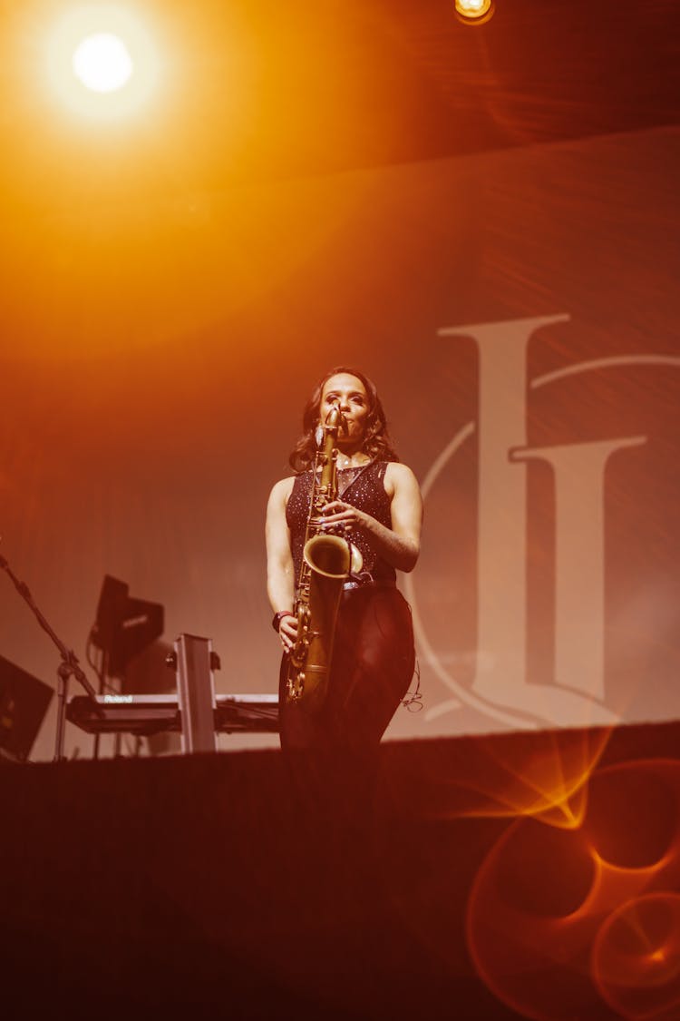 Woman Playing The Saxophone During Concert