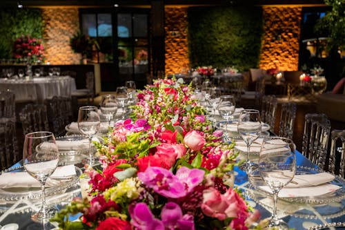 Long Table in Restaurant Decorated with Flowers