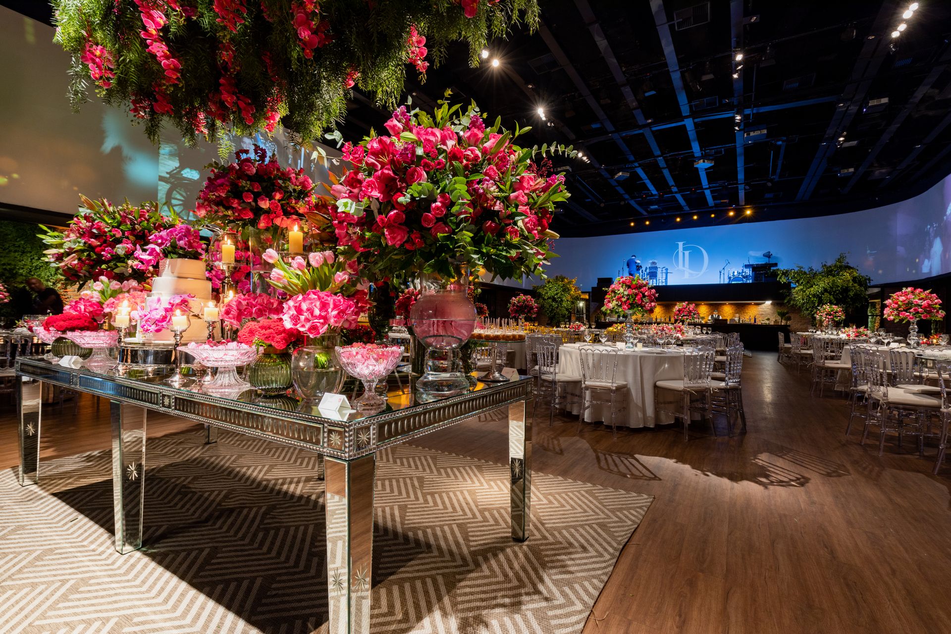 Lavish reception hall with floral arrangements and elegant table setup