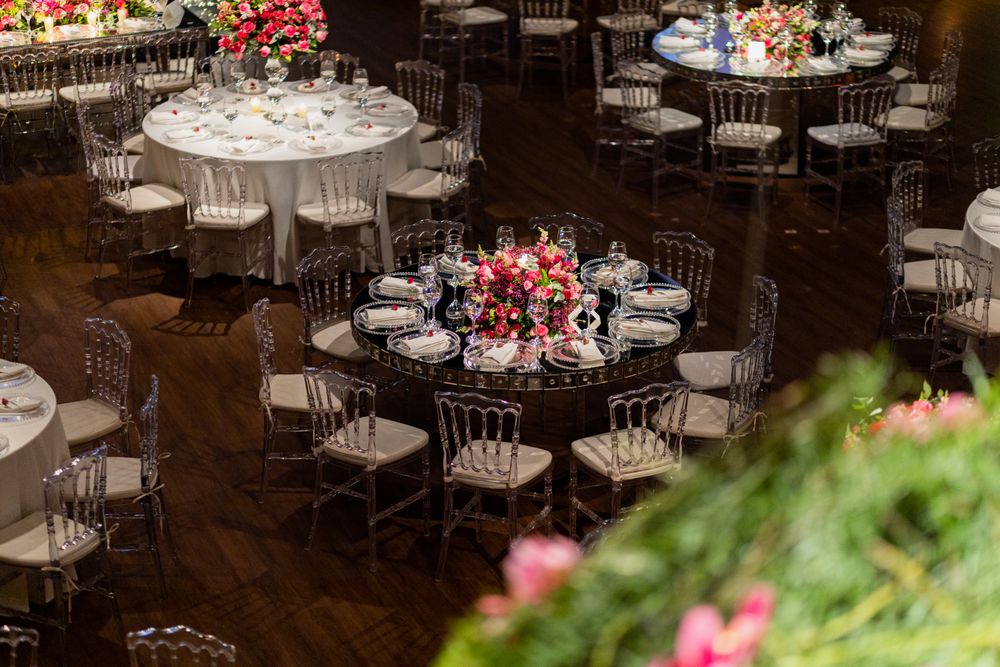 Banquet hall with round tables set for a corporate gala