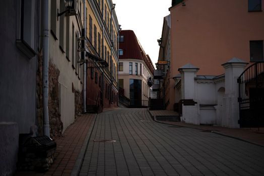 Charming narrow alley in a historic European town with classic architecture and evening ambiance.