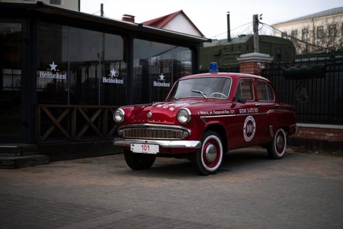 Free Retro Moskvitch 407, vintage red car parked outside a restaurant in Minsk. Stock Photo