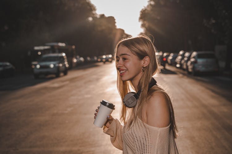 Smiling Blonde Woman With Headphones