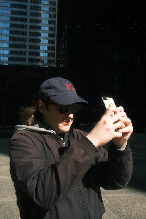 Man Taking Pictures with Cellphone