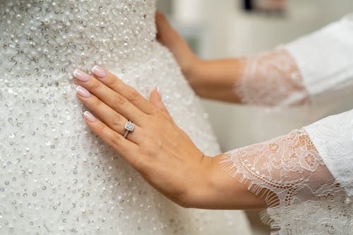 Free Woman Touching a Wedding Dress  Stock Photo