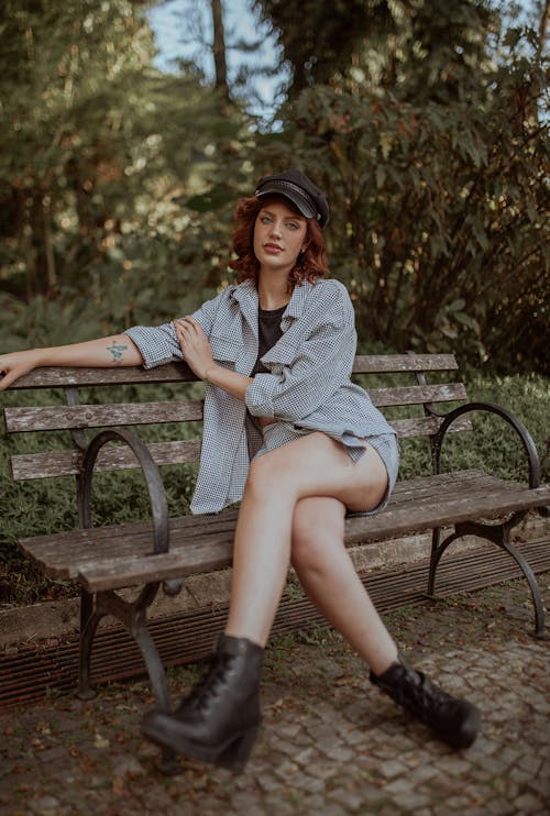 Young Redhead Sitting on a Park Bench