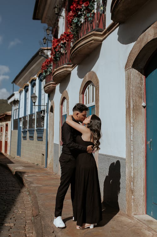 Couple Kissing on Street in Old Town 
