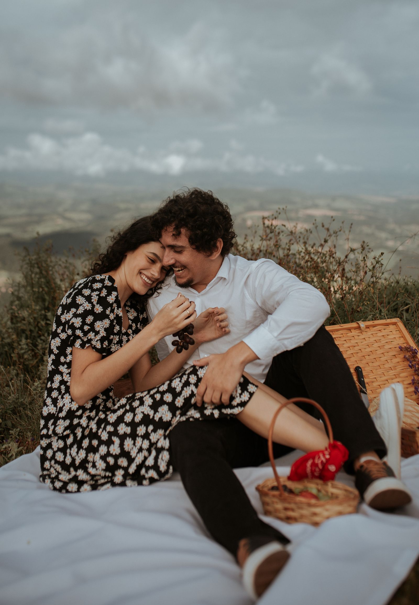 Two people smiling during a picnic