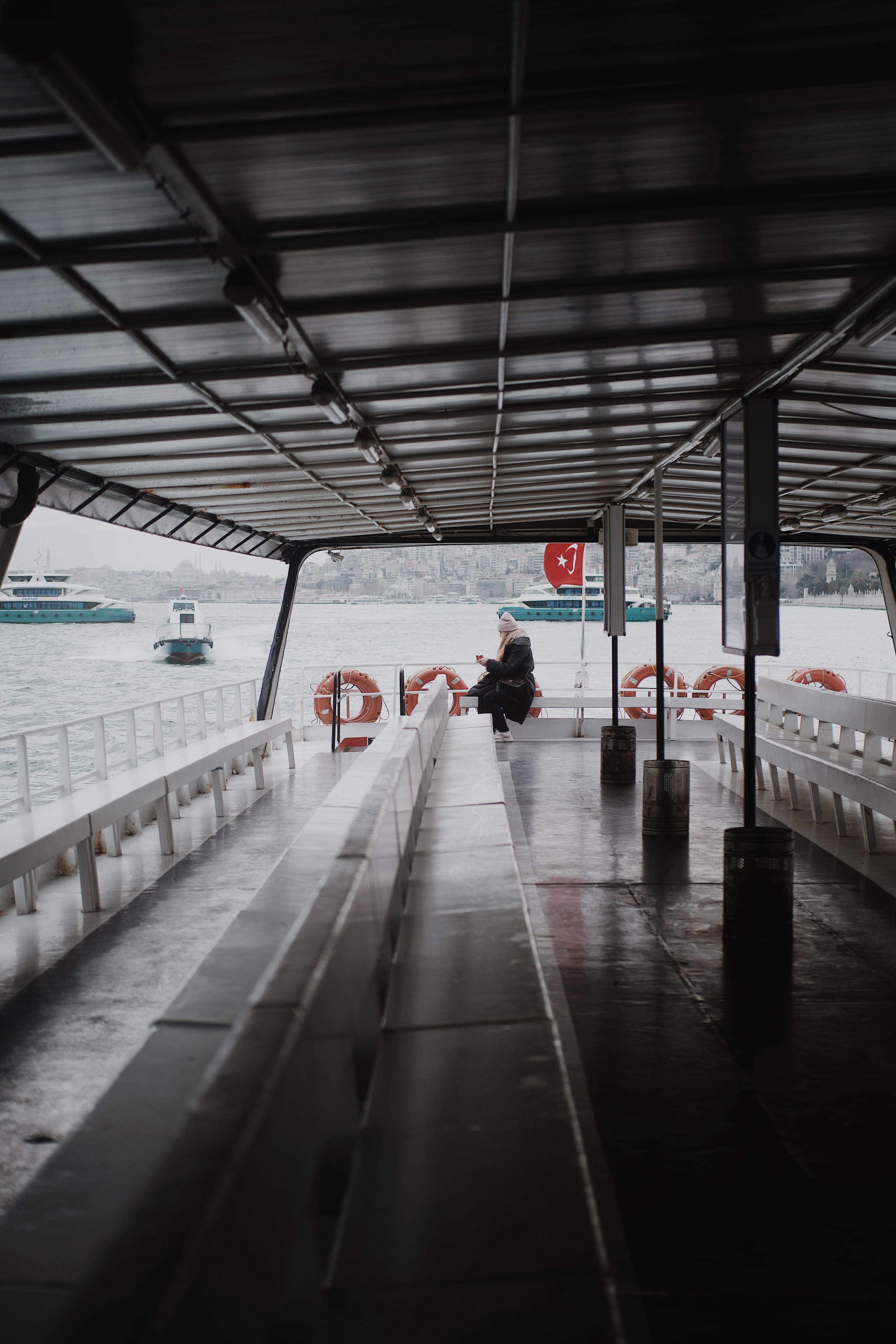 Person Sitting on a Passenger Boat Cruising in the Bosphorus Strait in ...