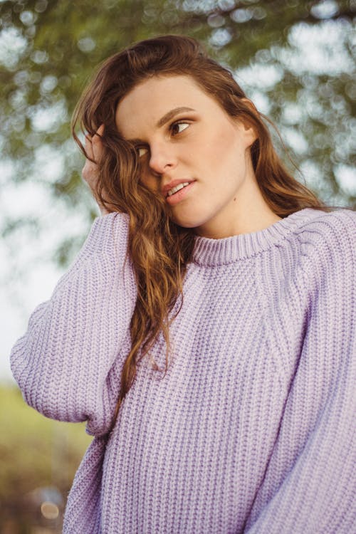 Woman in a Lavender Sweater with a Hand in Hair