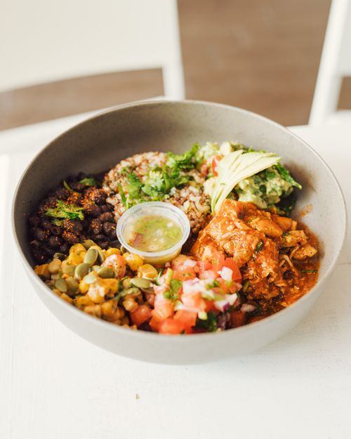 Free A vibrant Mexican salad bowl featuring avocado, chicken, beans, and salsa, perfect for a nutritious meal. Stock Photo