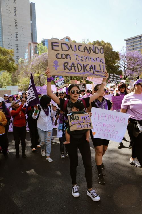 Free A diverse group of women participating in a city protest advocating for women's rights and empowerment. Stock Photo