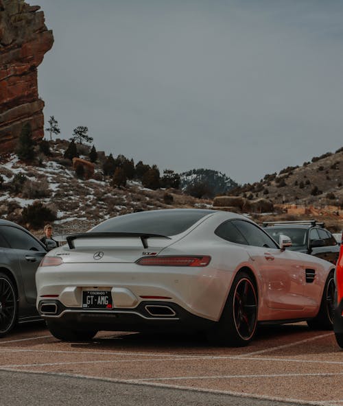 A Mercedes-Benz AMG GT on a Parking Lot near Geological Formations 