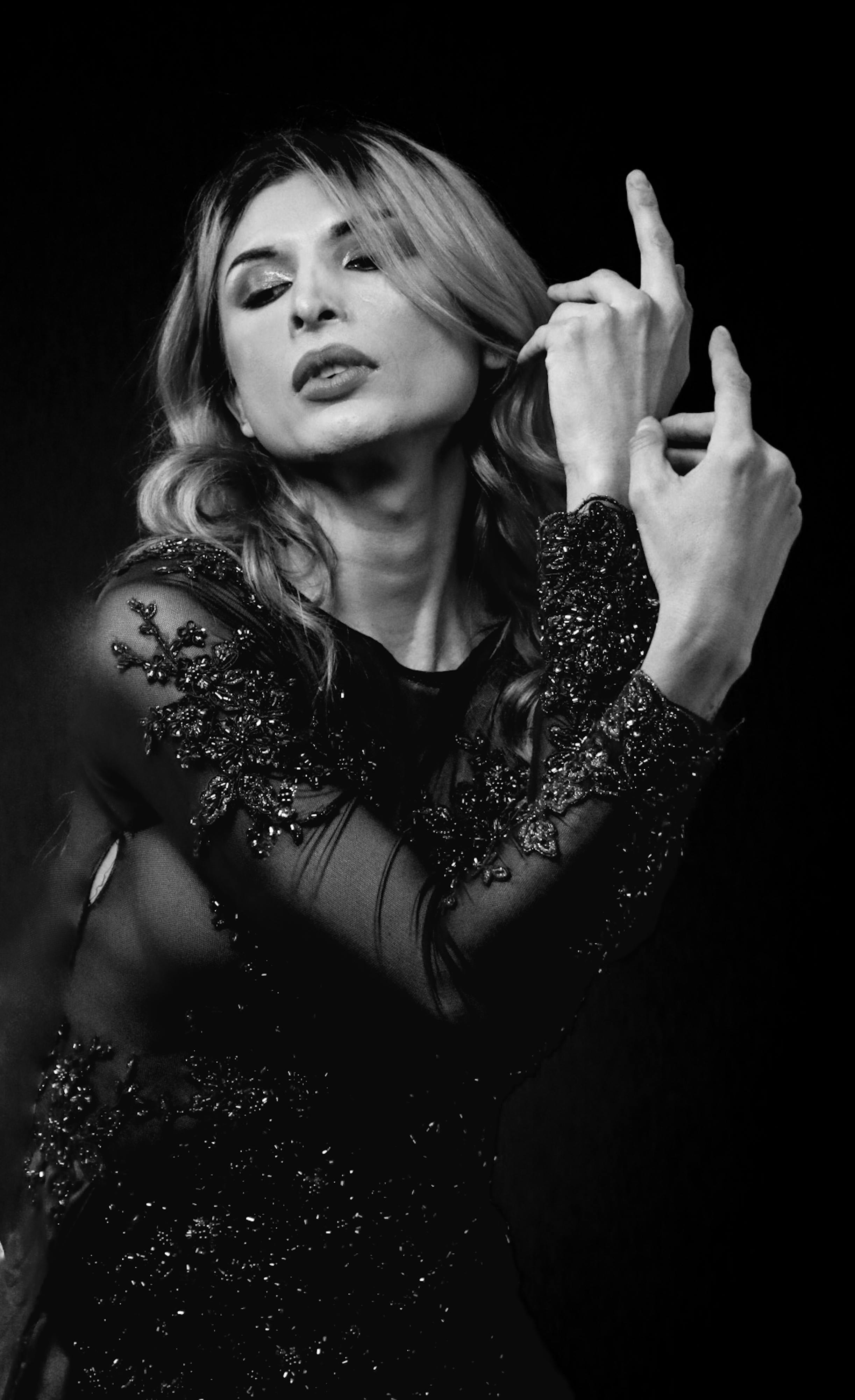 Woman in Boots Sitting by Desk with Laptop · Free Stock Photo