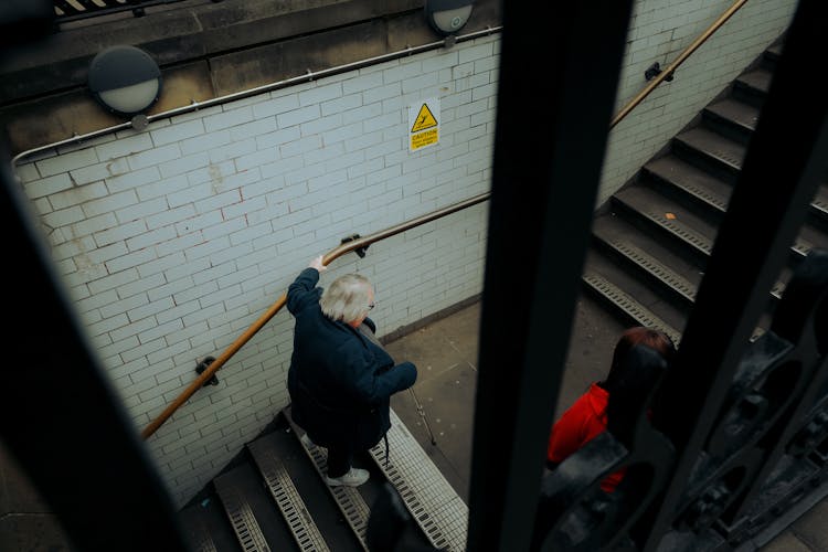 Elderly Woman On Stairs