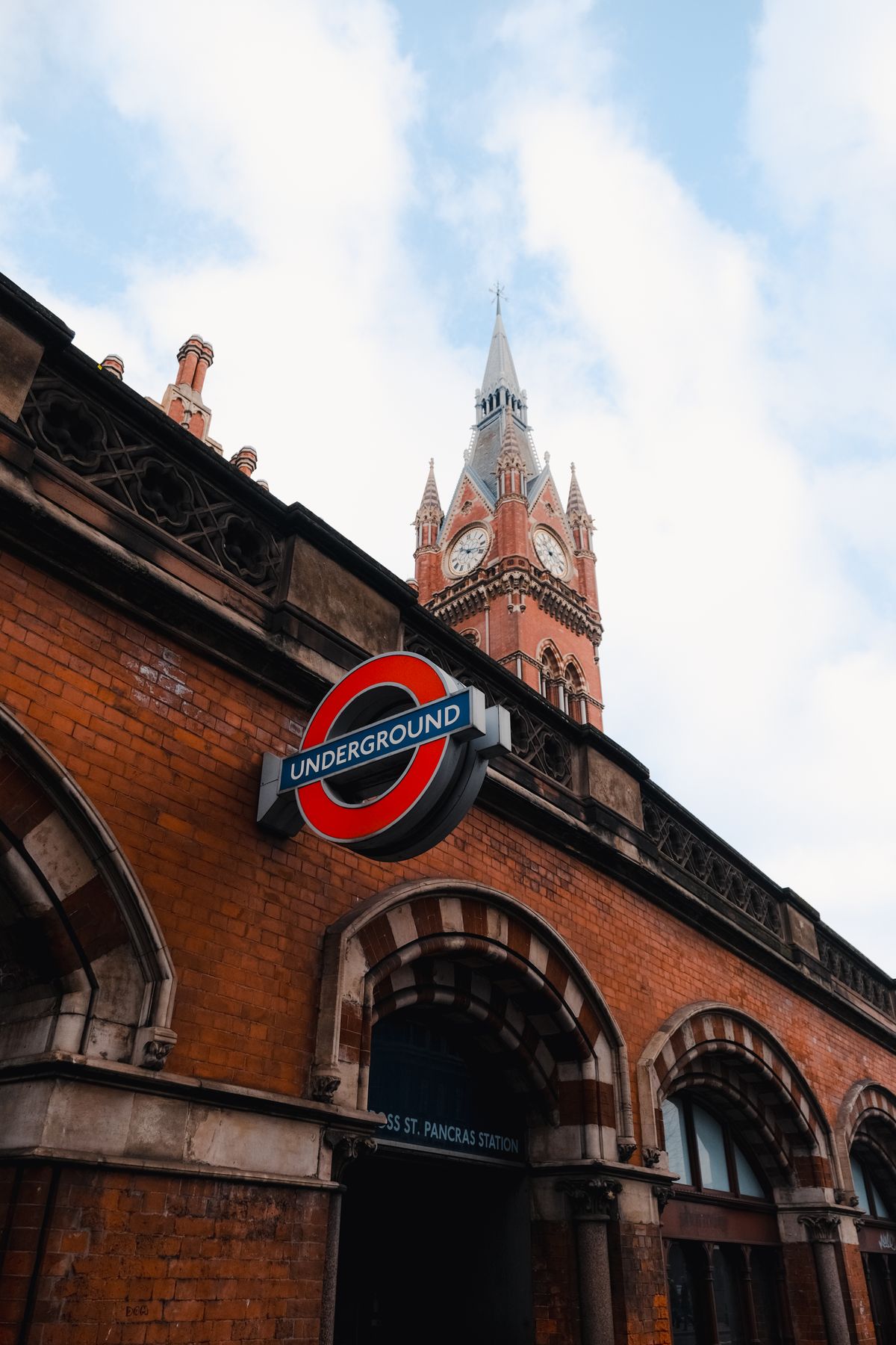 The Underground sign and clock tower at St Pancras station, London