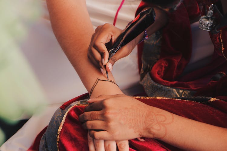 Person Tattoing Person's Arm