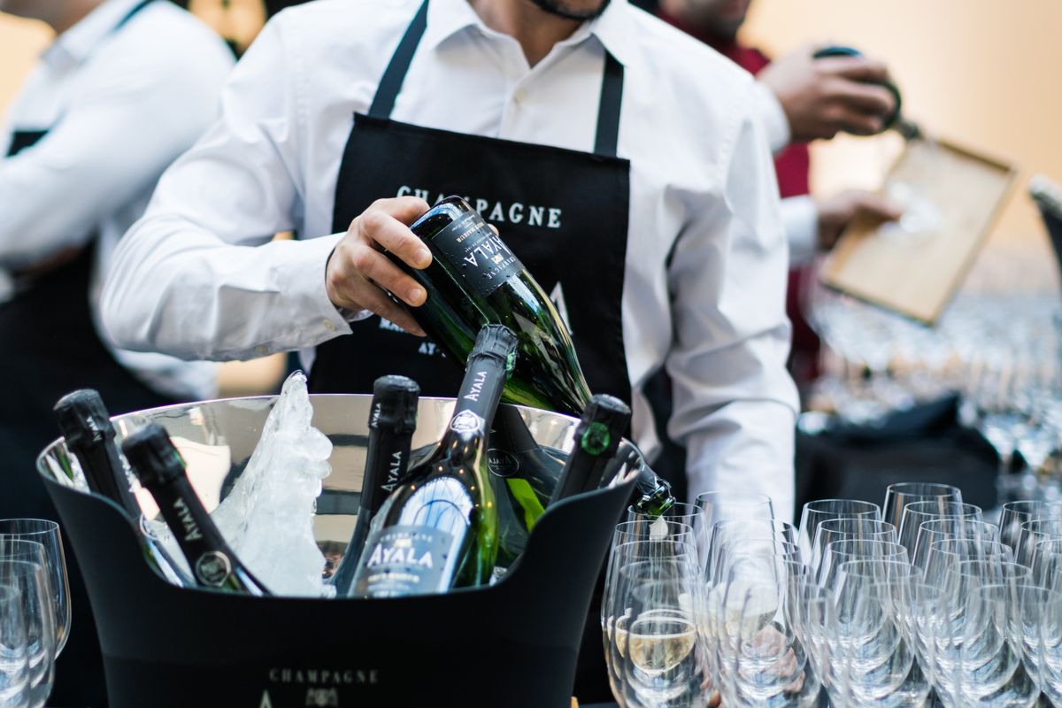 Professional event staff serving guests