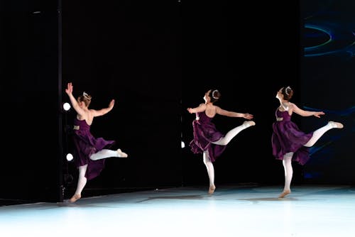 Three Ballerinas Dancing on Stage