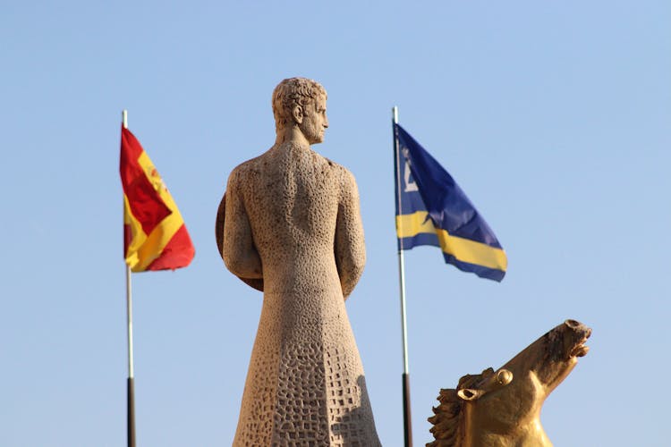 Historic Statue And Flags 