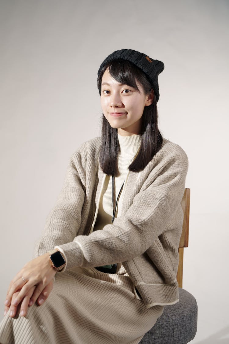 Portrait Of A Woman Sitting On A Chair 