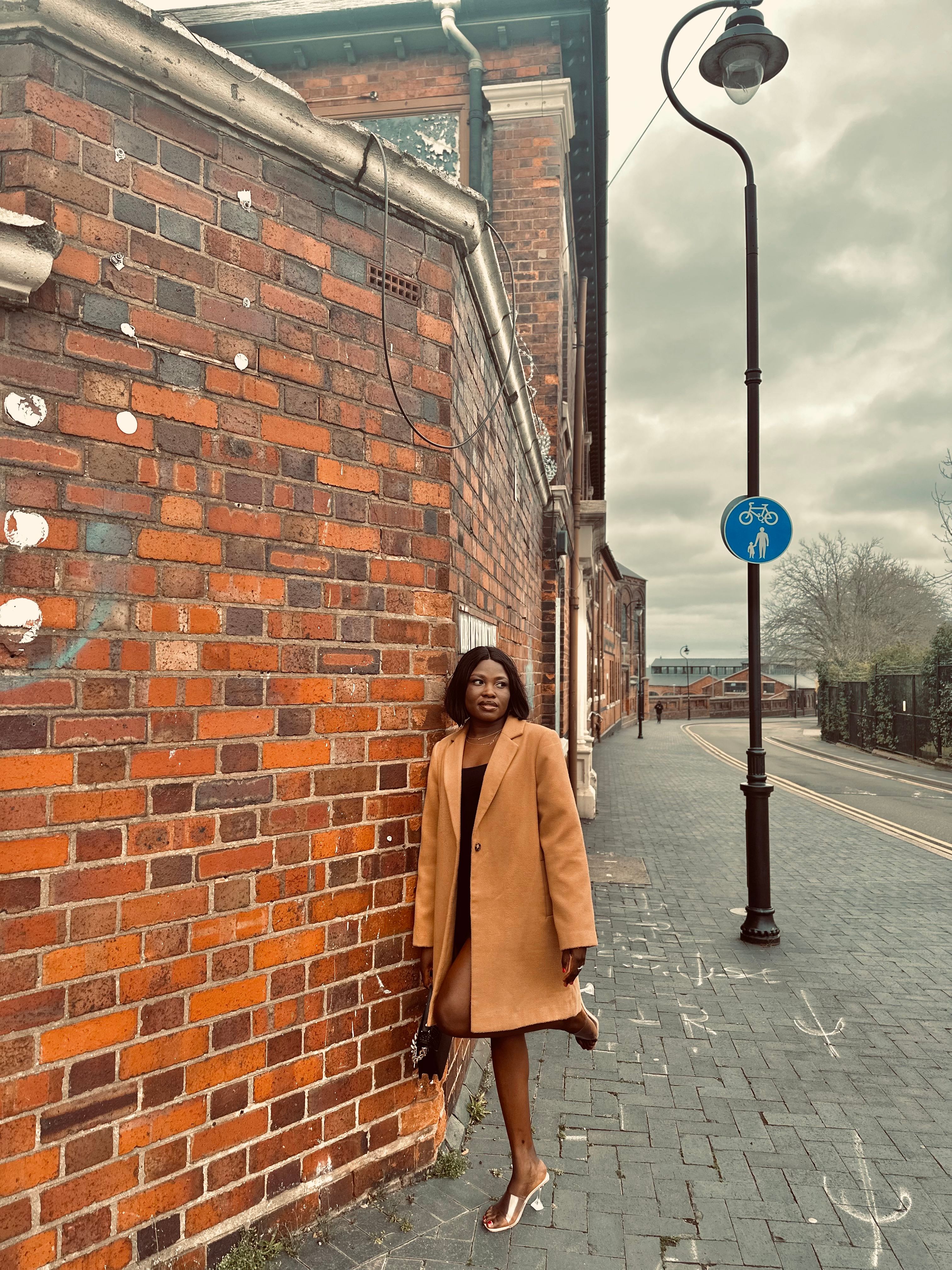 Woman in Coat on City Street · Free Stock Photo