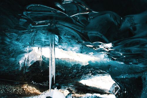 Free Explore the mesmerizing interior of an ice cave in Iceland, adorned with stunning ice formations and icicles. Stock Photo