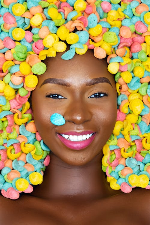 Colorful Candies around Woman Face