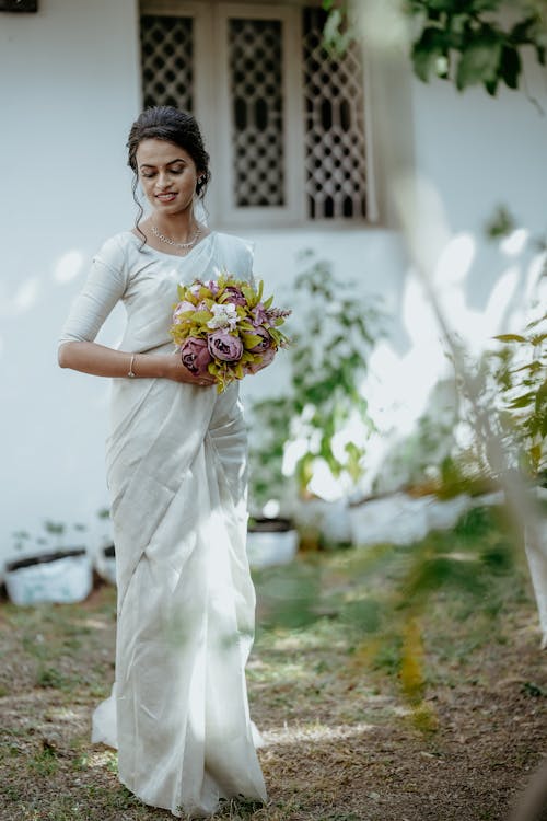 Bride in Wedding Dress and with Flowers