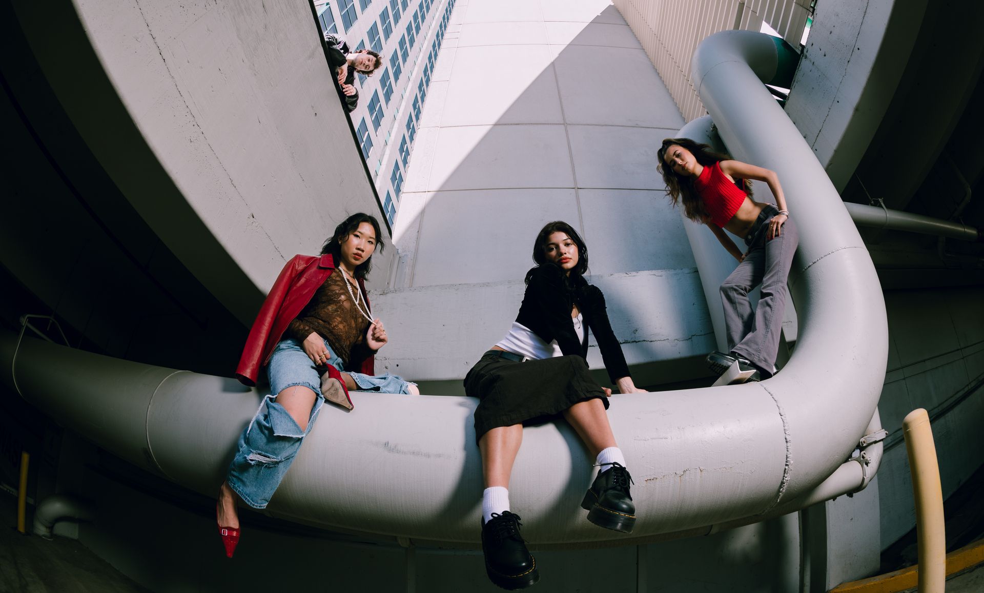Women Posing on a Pipe