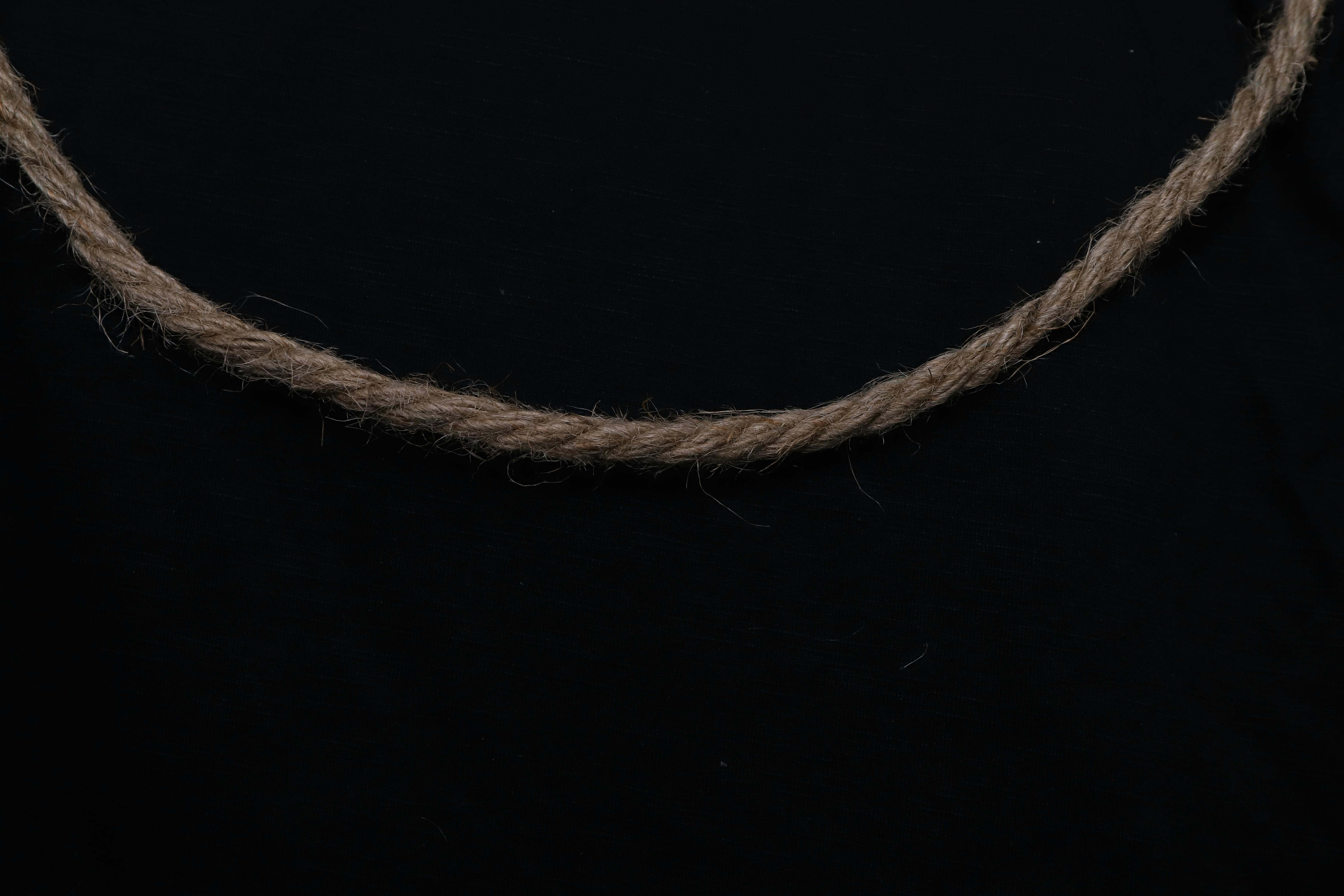 Free stock photo of black background, brown rope, draped rope