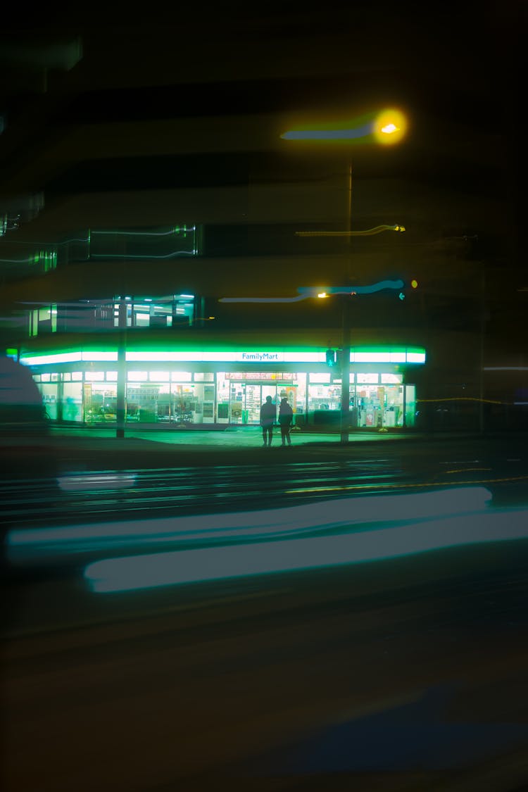 Illuminated Store Near The Street In City At Night 