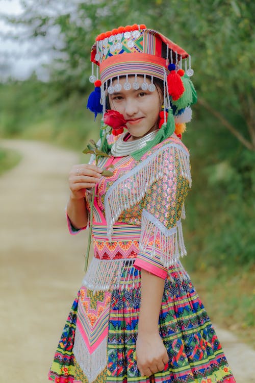 Woman Standing on Path Wearing Traditional Clothing