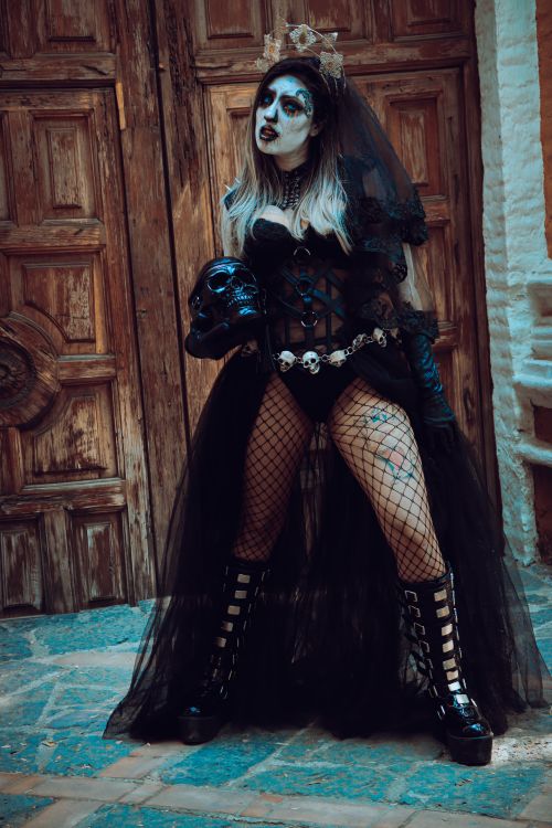 Free Woman in a gothic Day of the Dead costume posing with skull in Mexico City. Stock Photo