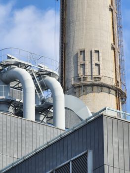 Detailed view of a factory chimney and pipes in Huang Pu Qu, Shanghai, China.