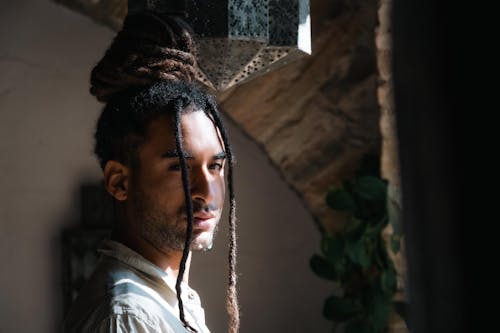 Portrait of Young Man with Dreadlocks on his Hair