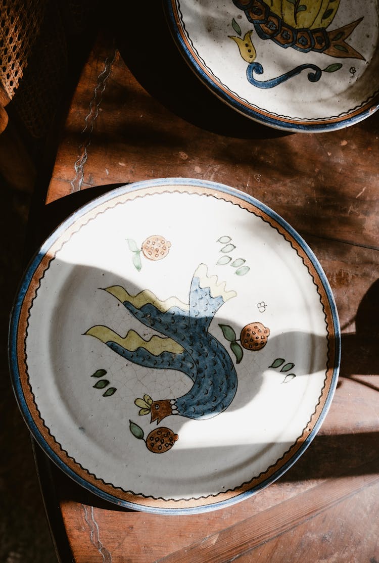 Vintage Pottery With Painted Illustrations 