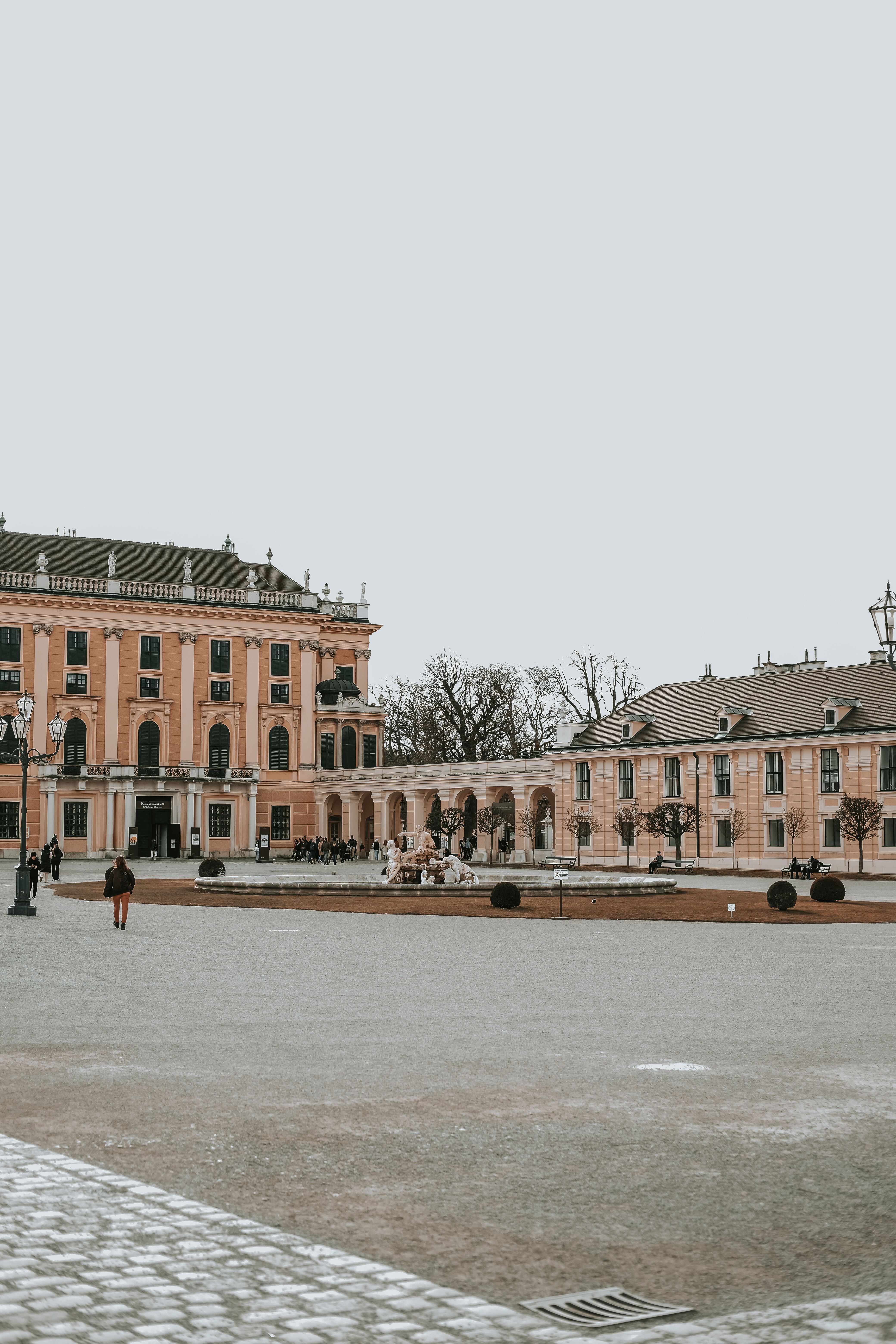 Free Quiet courtyard at Schonbrunn Palace in Vienna showcasing historic architecture. Stock Photo