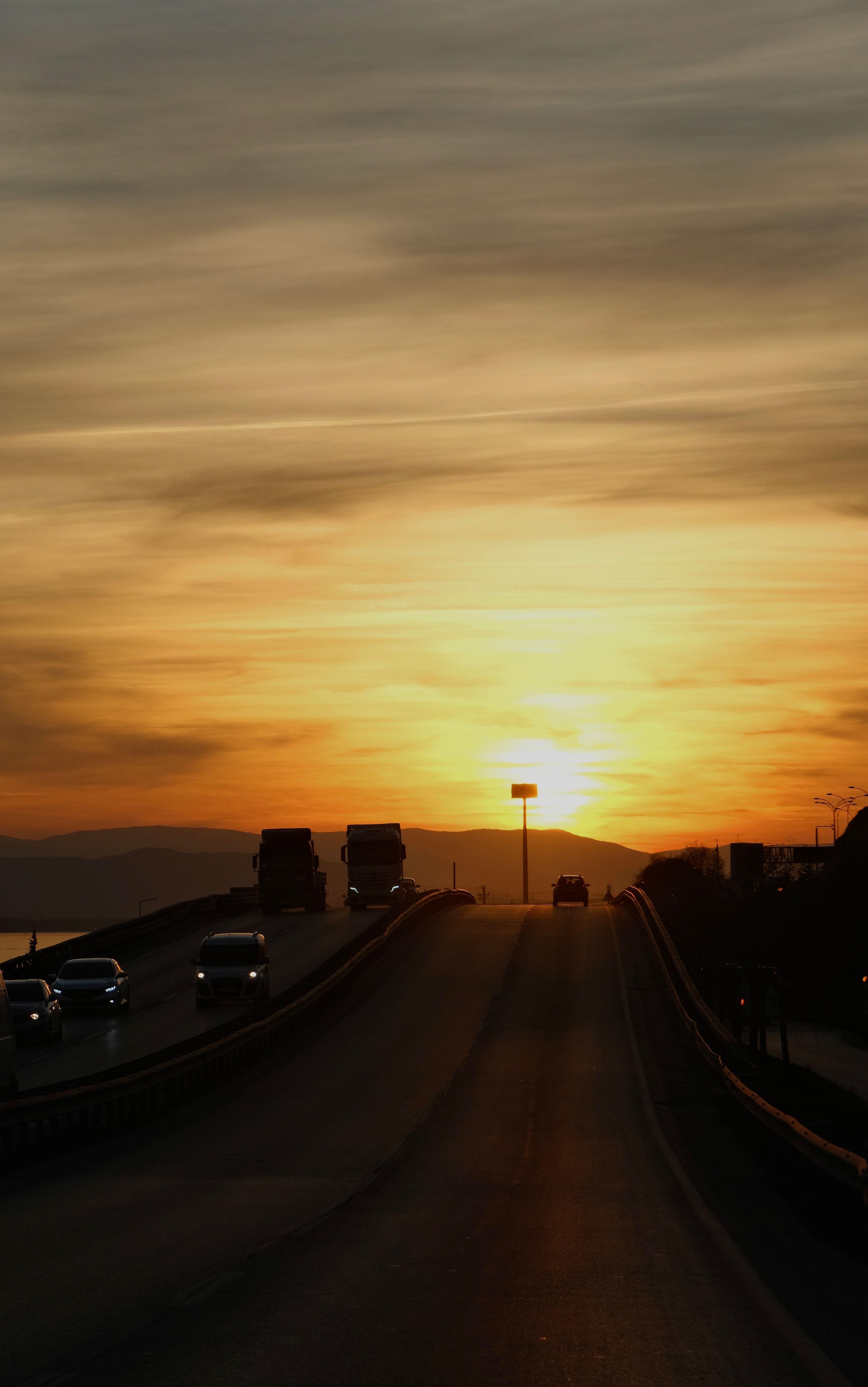 Cars on a Highway at Sunset · Free Stock Photo