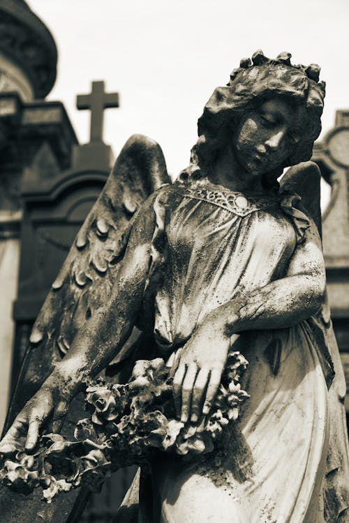 Free Sculpture on the Grave at the La Recoleta Cemetery in Buenos Aires, Argentina Stock Photo