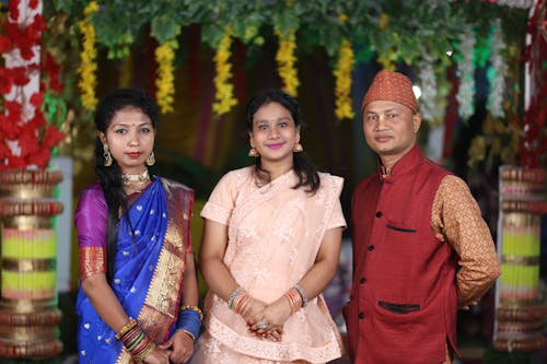 A Family Wearing Traditional Clothing at a Festival 