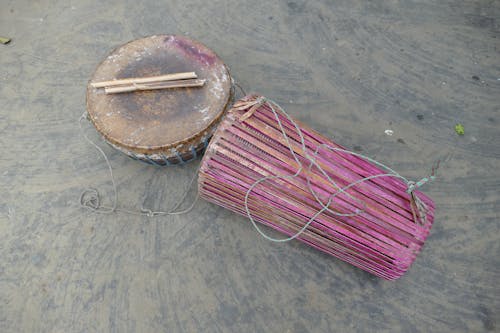 Top view of Tamak and Tumdak Drums with Drumsticks